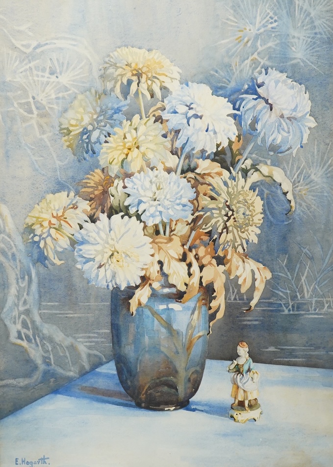 E. Hogarth, Still life of a vase with chrysanthemums and china figures, signed, watercolour, 74 x 51cm